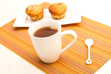Vanilla with chocolate chips Muffins with a cup of tea