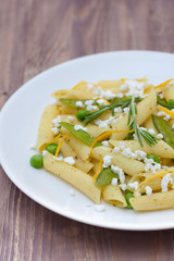 Delicious vegetarian pasta, wooden background