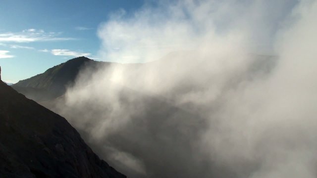Foul-smelling fumes over Bromo volcano. Java, Indonesia