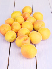 Fresh natural apricot on wooden table close up