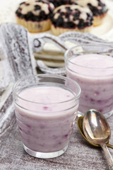 Blueberry smoothie on wooden rustic tray. Summer party