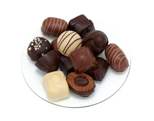 chocolate candies on glass plate