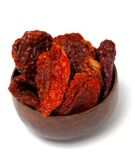 dried tomatoes in a wooden bowl