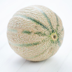 Ripe cantaloupe melon, close-up, studio shot