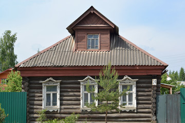 Old log house with carved platbands