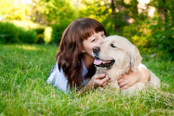 Young woman with a golden retriever