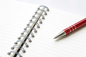 ring binder book or notebook with pen