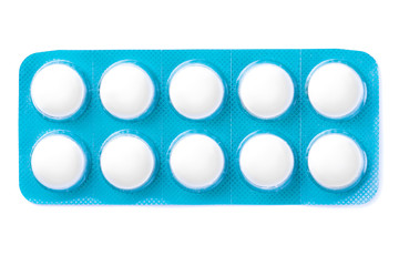 Tablets in a blue package isolated on white.