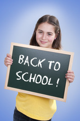 Happy school girl with chalk board