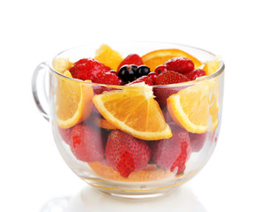 Useful fruit salad in glass cup isolated on white