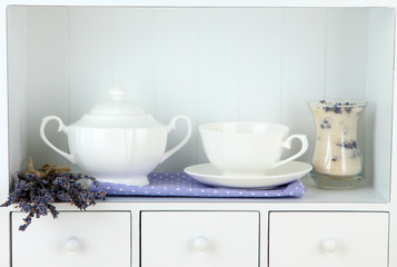 Still life with glass of lavender sugar, cup and fresh lavender