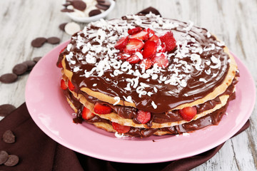 Chocolate cake on wooden table close-up
