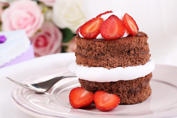 Chocolate cake with strawberry on table close-up