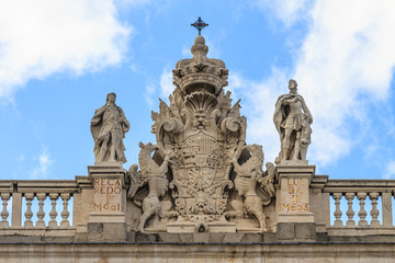 Fototapeta na wymiar Madrid Royal Palace, Coat of arms on top of palace, Spain