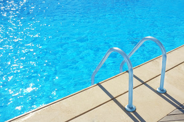 Fototapeta na wymiar Swimming pool with stairs