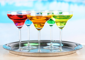 Different cocktails on bright background