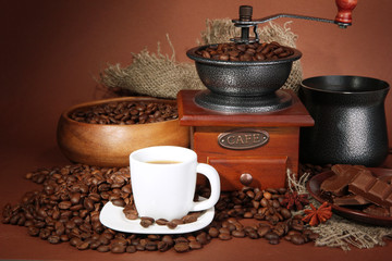 cup of coffee, grinder, turk and coffee beans