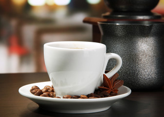 cup of coffee, grinder, turk and coffee beans in cafe