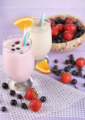 Delicious milk shakes with orange and blackberry