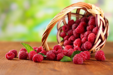 Ripe sweet raspberries in basket