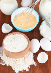 Ingredients for dough on wooden table close-up