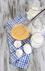 Ingredients for dough on wooden table close-up