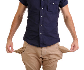 Man showing his empty pockets, isolated on white