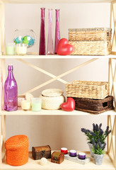 Beautiful white shelves with different home related objects,