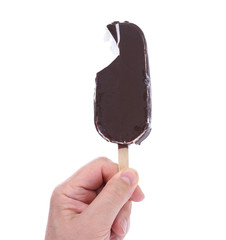 Bitten chocolate vanilla ice cream on stick.