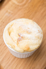 form with peach souffle on wooden board, top view