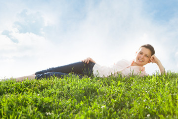 Young Woman Relaxing In Grassland