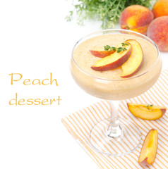 peach souffle in glass and fruit in the background, isolated