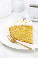 piece of orange cake decorated with Greek yogurt, honey
