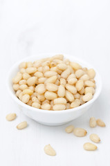 pine nuts in a bowl, vertical