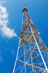 Fototapeta na wymiar Telecommunication tower on blue sky