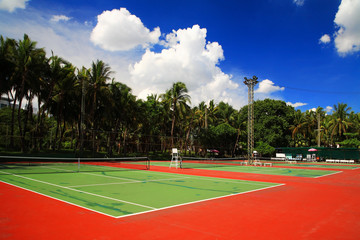 Outdoor tennis hard courts against blue sky