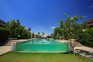 swimming pool against blue sky at luxury resort