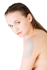 Fototapeta premium Beautiful face of spa woman with healthy clean skin and clay mas