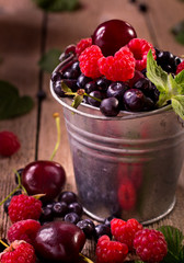 Various berries in pail