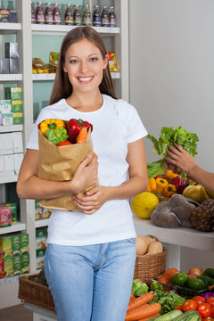 Young Woman With Vegetable Bag