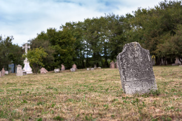 Weathered tombstone in an old cemetery