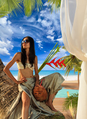 Obraz na płótnie Canvas Woman by the swimming pool at tropical resort