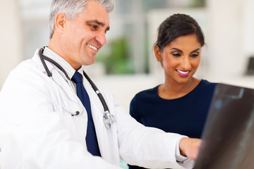 senior doctor examaning patient x-ray