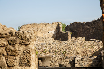 Pompeii Ruins with Crumbling Wall in Foreground