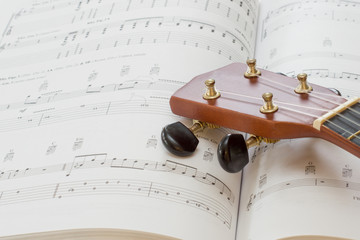 A ukulele and music book