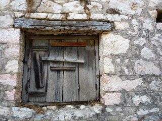 delapidated wooden Mediterranean Shutter	