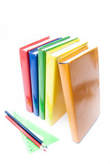 Colorful real books on white background