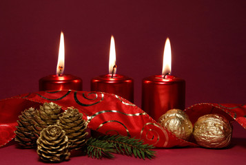 Three burning red candle