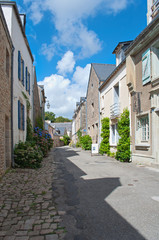 Fototapeta na wymiar Typical street in Brittany with houses made of stone