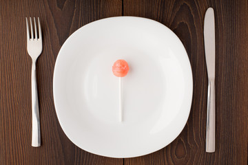 Lillipop on a white plate